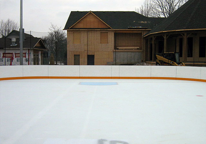 50' x 100' permanent rink with three (3) RinkMate chillers, rink boards, protective netting and plexi glass